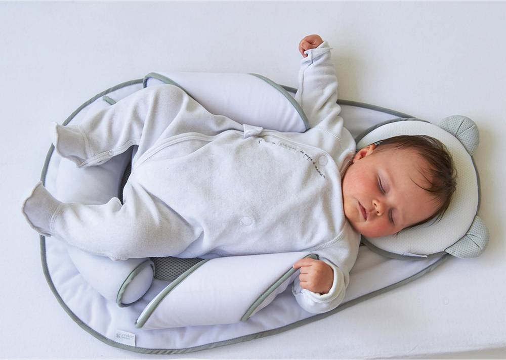 Позиционер для сна новорожденного: как выбрать